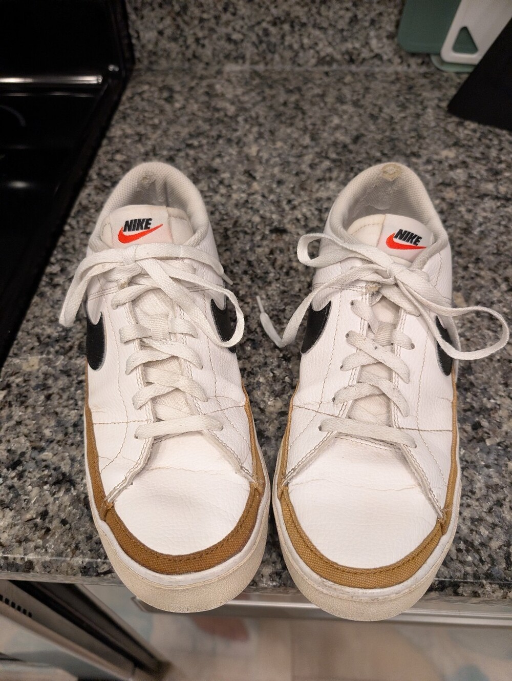 Nike Men’s White Leather Sneakers with Black Swoosh and Brown Trim